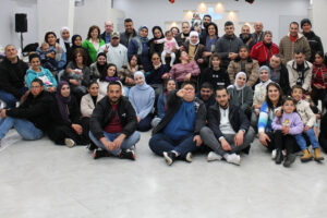 photo of many from the L'Arche community in Bethlehem gathered together