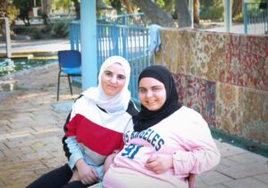 Two friends sitting together